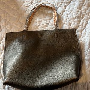 Black leather tote with small zipper pouch. NWT